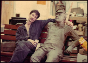 Micheal Parks resting with Seward Johnson bronze